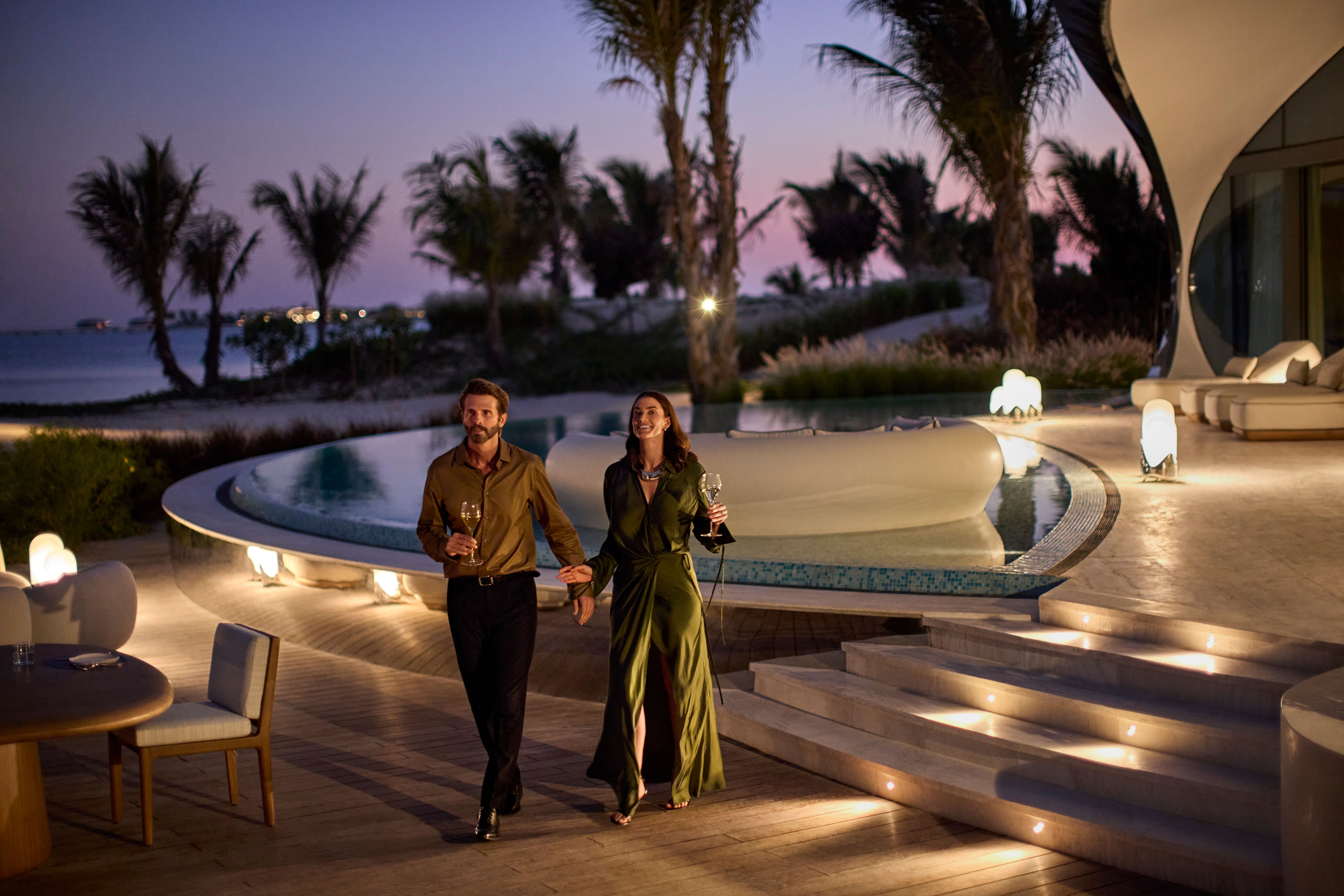 Private villas for couples on a romantic retreat, sharing an intimate evening drink