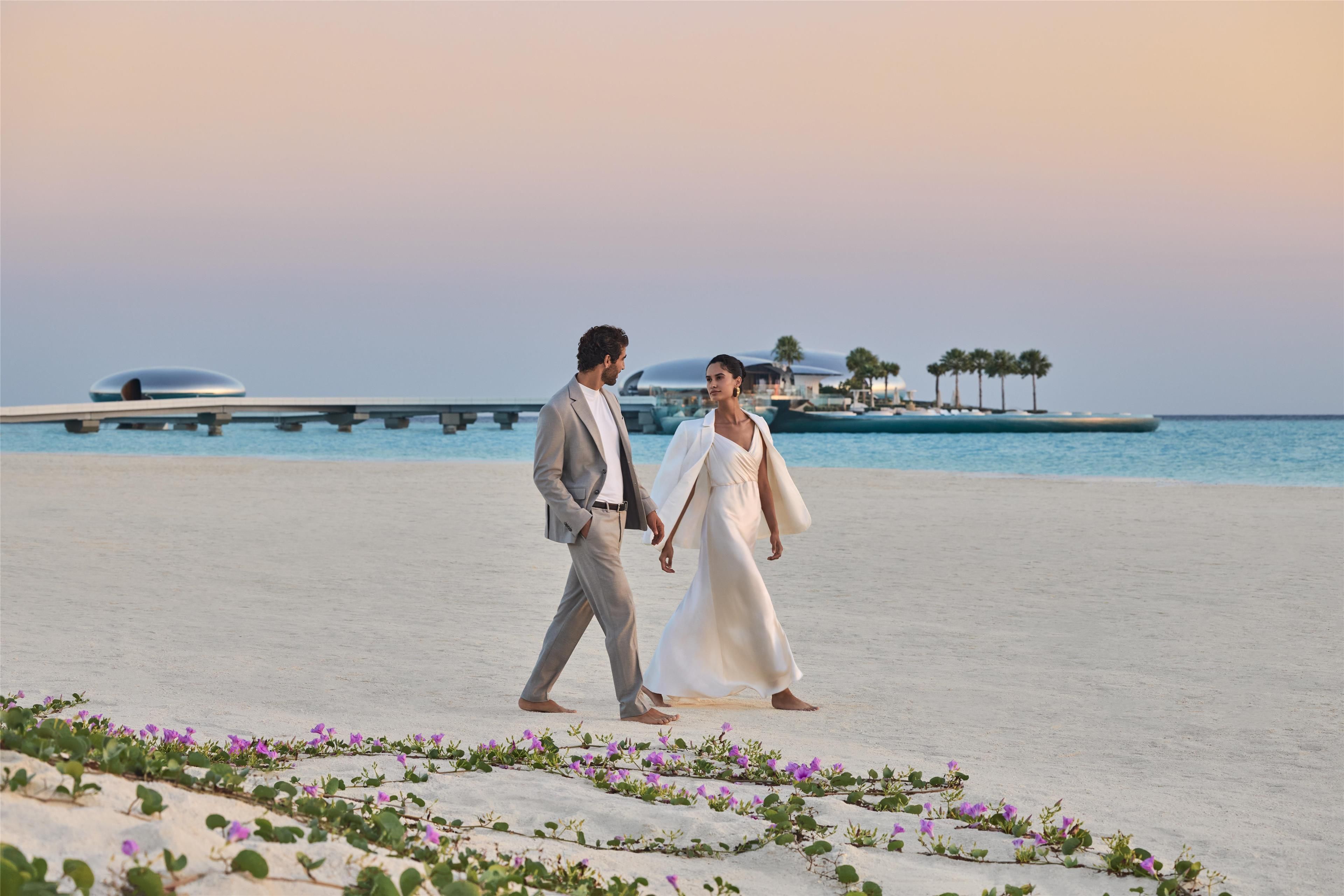 luxury resort romantic couples getaway walking on the beach